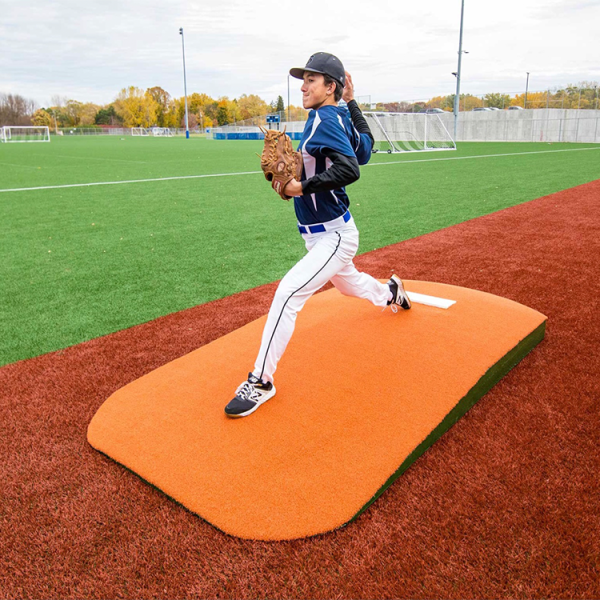 Measuring 10″ H x 5′ W x 10′ 6″ L and weighing only 160 lbs, this portable mound grips gym floors without scratching and is perfect for 14+ batting practice, bullpens, and facilities
