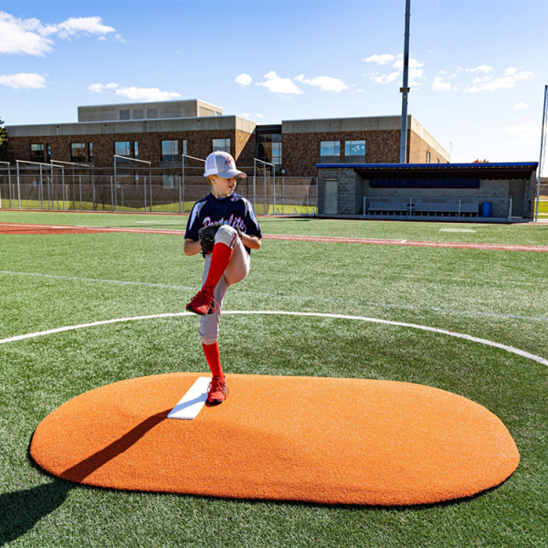 The Portolite 6” One Piece Game Mound is perfect for players 14 and under, featuring tapered edges, durable turf, and weighs only 120 lbs for easy small group transport