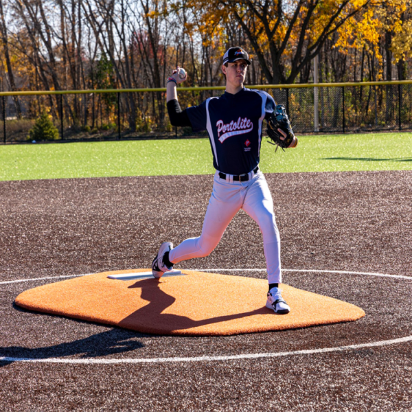 The Portolite 6” Oversized One Piece Game Mound is ideal for ages 14 and under, with tapered edges, durable turf, and easily portable with a small group