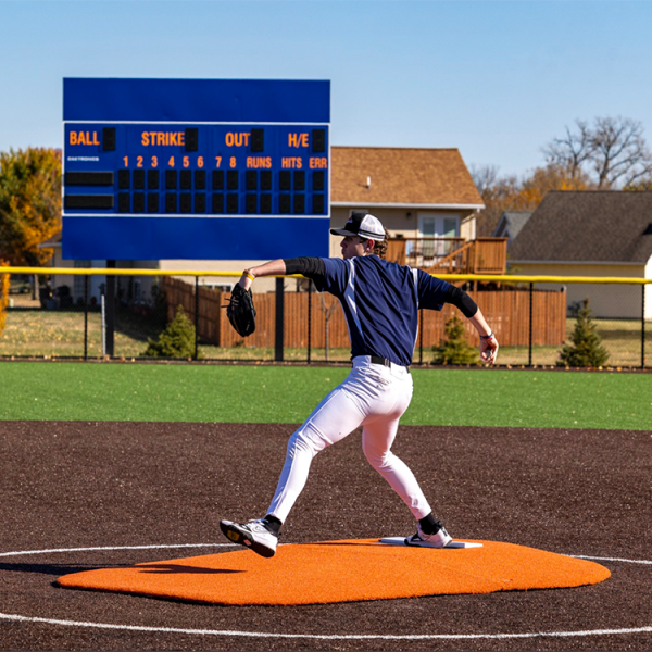 The Portolite 6” Oversized Two Piece Game Mound is ideal for ages 14 and under, with tapered edges, durable turf, and lightweight sections for easy field portability