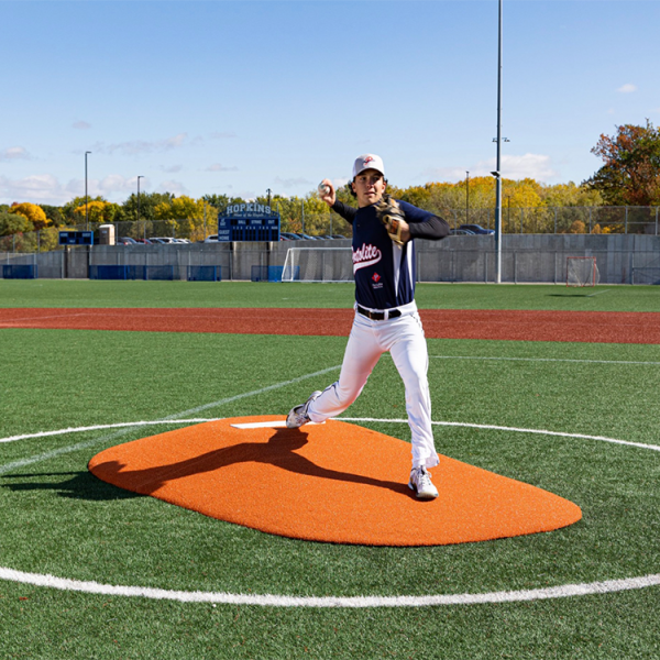 The Portolite 10” Game Mound is ideal for ages 16+, featuring tapered edges, a durable wear pad, premium turf, and sectional design for easy portability