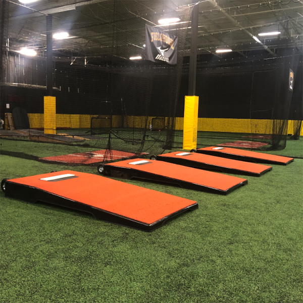 The Pitch Pro Model 504 Batting Practice Platform features a rigid, waterproof design with premium turf, leaving no marks on the field and offering easy transportability