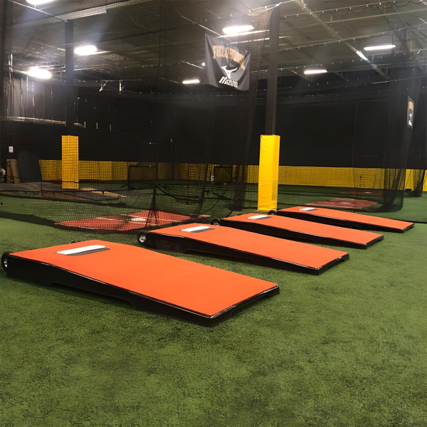 The Pitch Pro Model 516 Portable Bullpen Platform features a rigid, waterproof design with premium turf, leaving no marks on the field and offering easy transportability